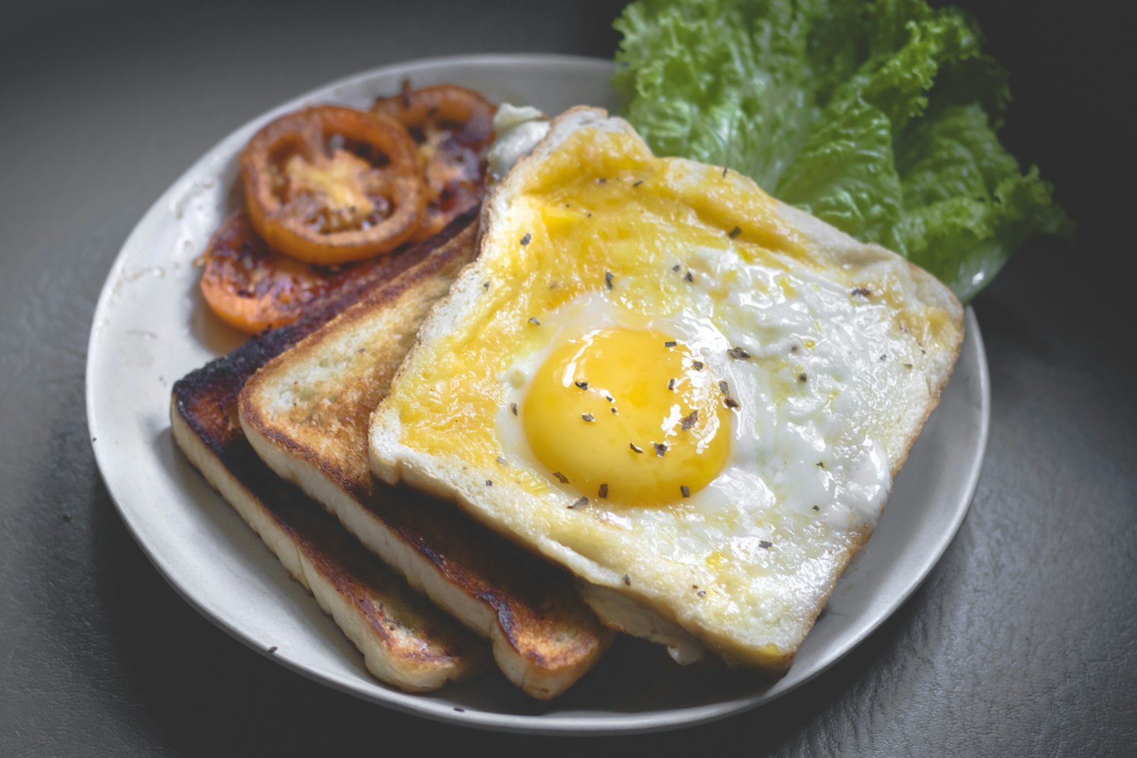 Breakfast spread with eggs, toast, and coffee